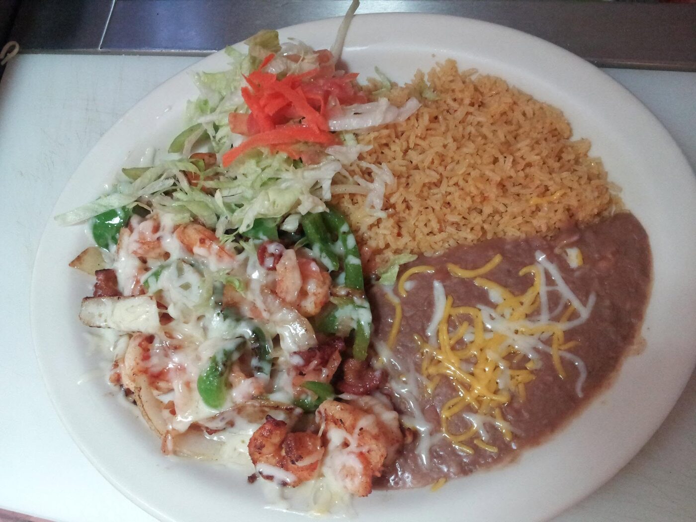 Seafood special with shrimp, peppers, rice and beans