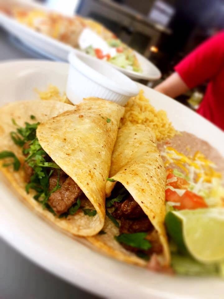 Steak tacos with cilantro, lime, rice and beans